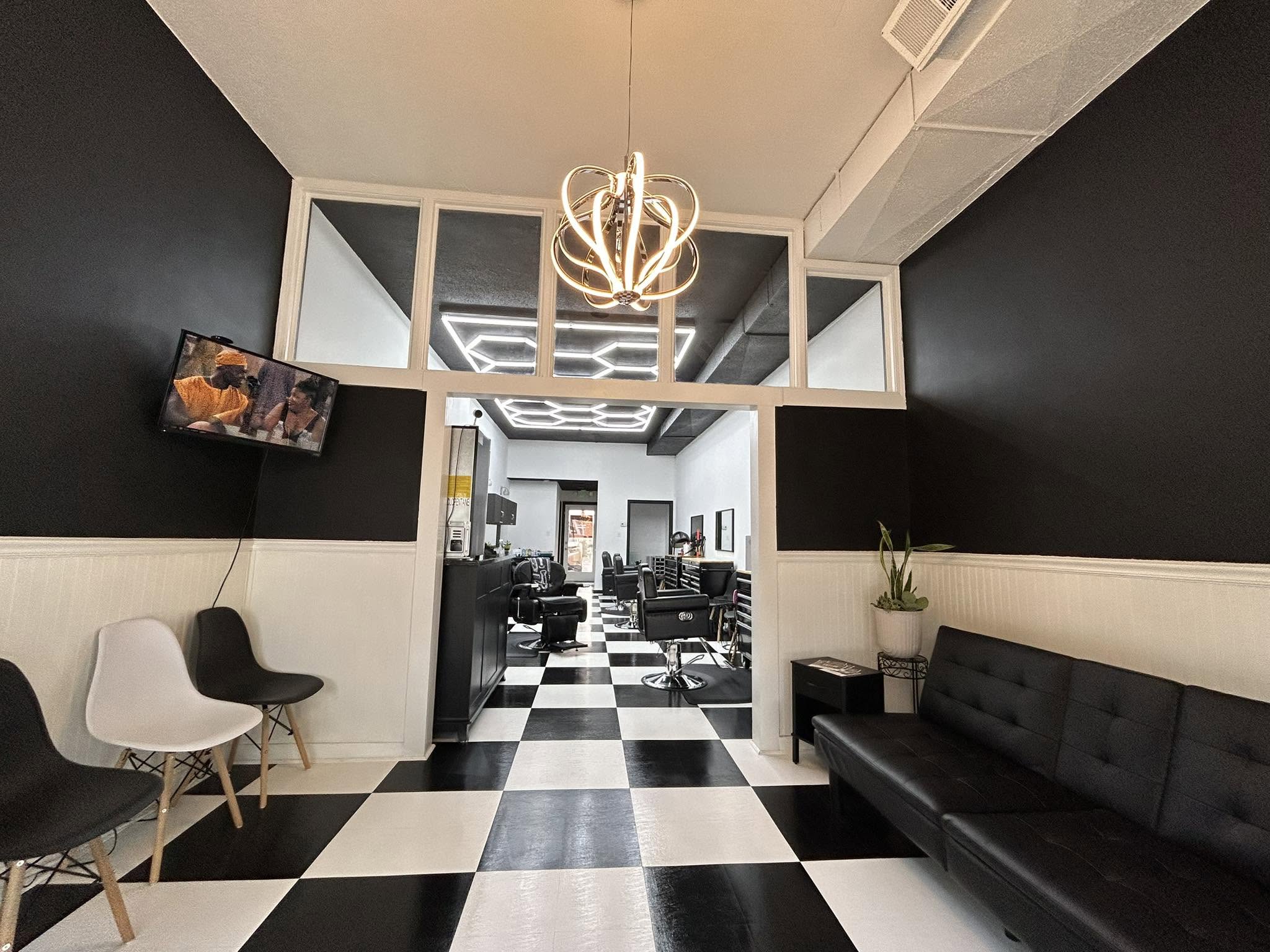 The black-and-white checkerboard interior of Main Street Barbershop